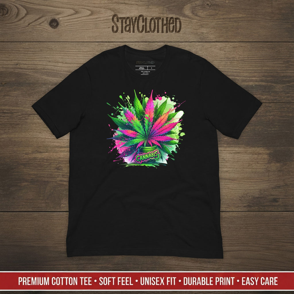 Black t-shirt with colorful cannabis leaf design on a wooden surface, featuring the brand 'StayClothed'.