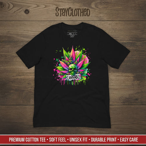 Black t-shirt with colorful cannabis leaf design on a wooden surface, featuring the brand 'StayClothed'.