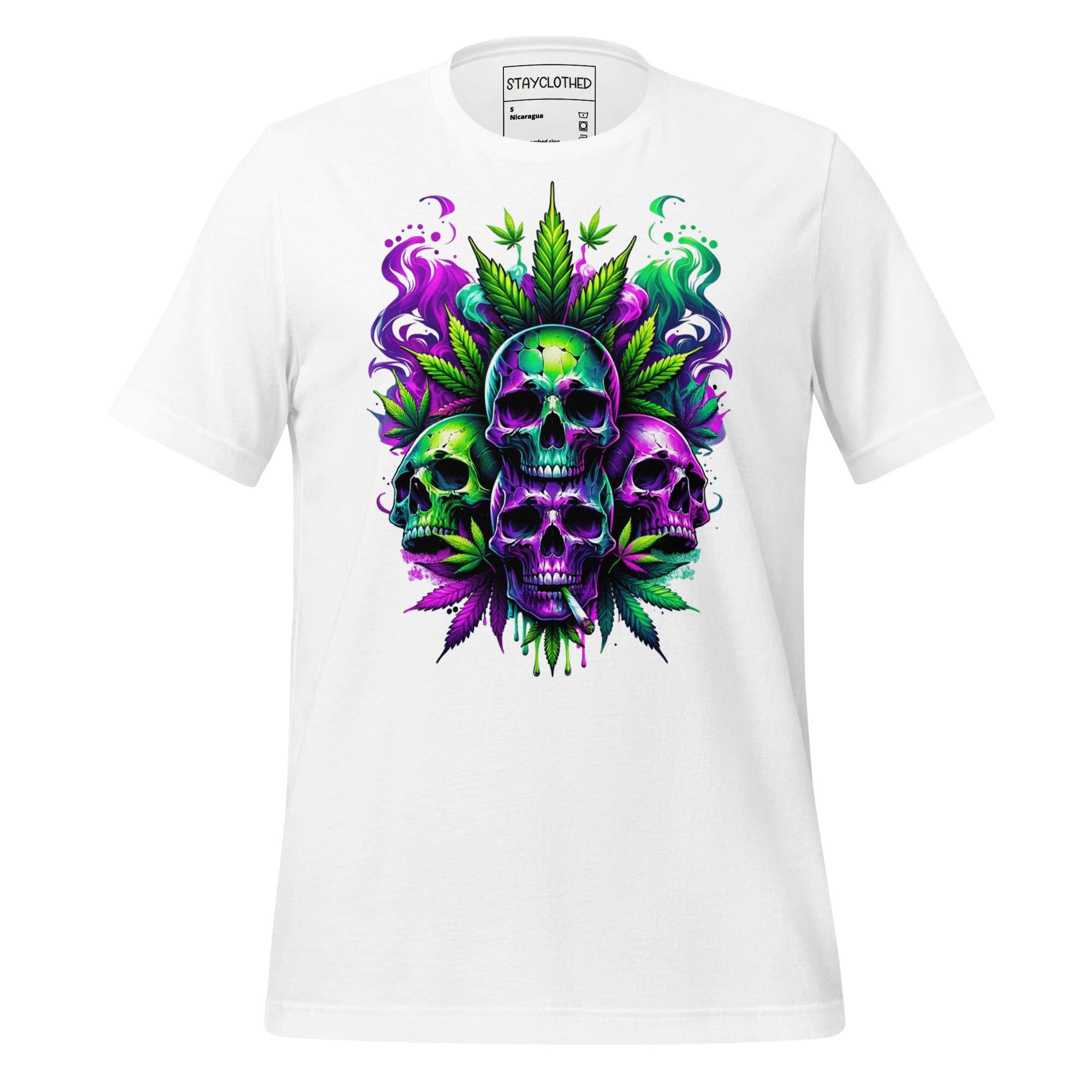 White t-shirt with colorful skull and cannabis leaf design on a wooden surface, featuring the brand 'StayClothed'.