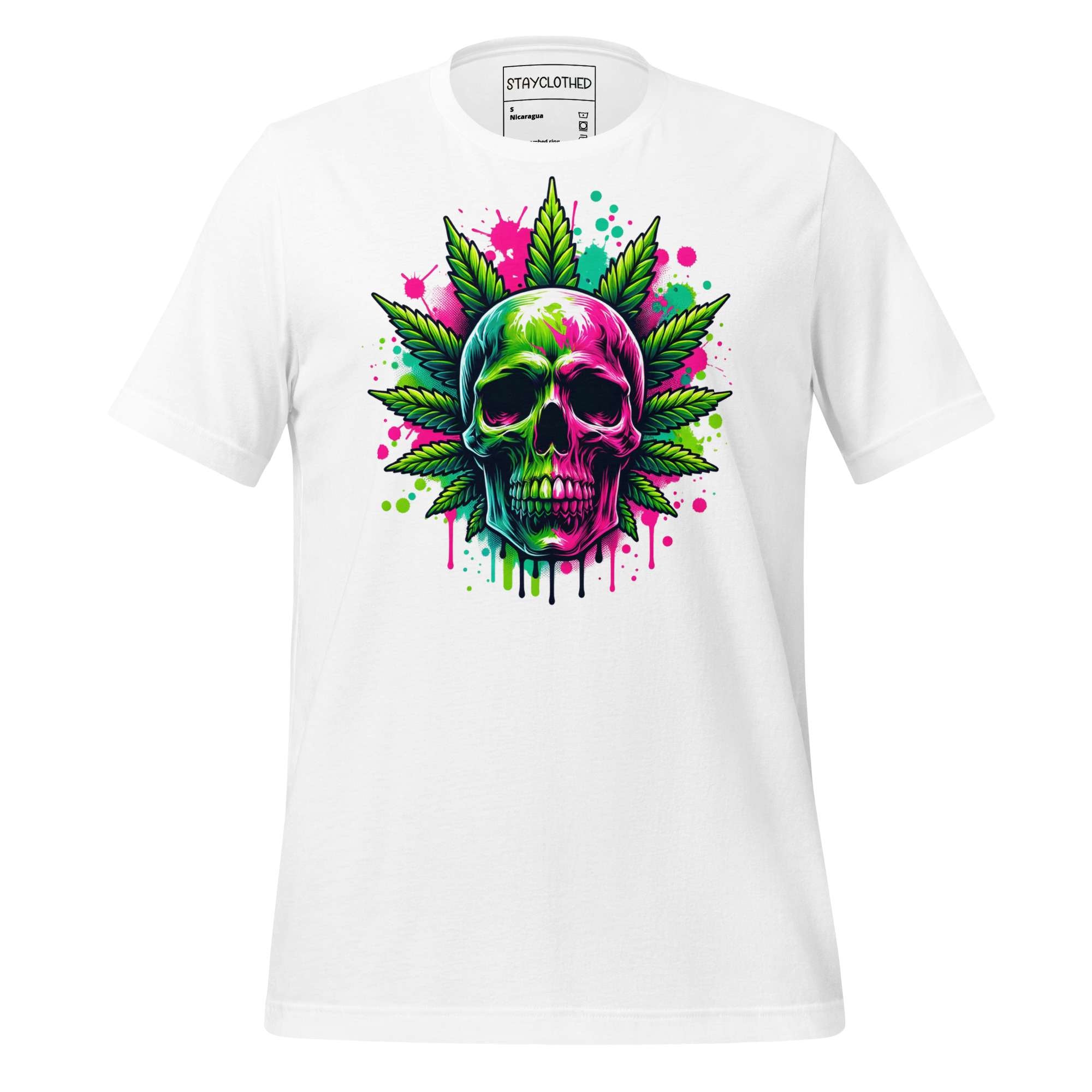 White t-shirt with colorful skull and cannabis leaf design on a wooden surface, featuring 'StayClothed' brand.