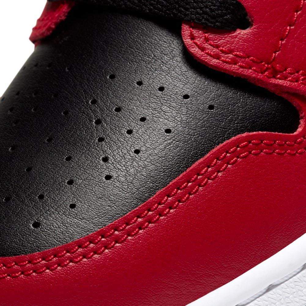 Air Jordan 1 Mid GS Chicago Black Toe trainers close detail view