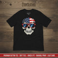 Black t-shirt with a skull design wearing American flag sunglasses on a wooden surface, featuring the brand 'StayClothed'.