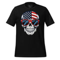 Black t-shirt with a skull design wearing American flag sunglasses on a wooden surface, branded 'StayClothed'.