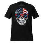 Black t-shirt with a skull design wearing American flag sunglasses on a wooden surface, branded 'StayClothed'.