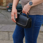Zatchels Aura black studded clutch bag detail view