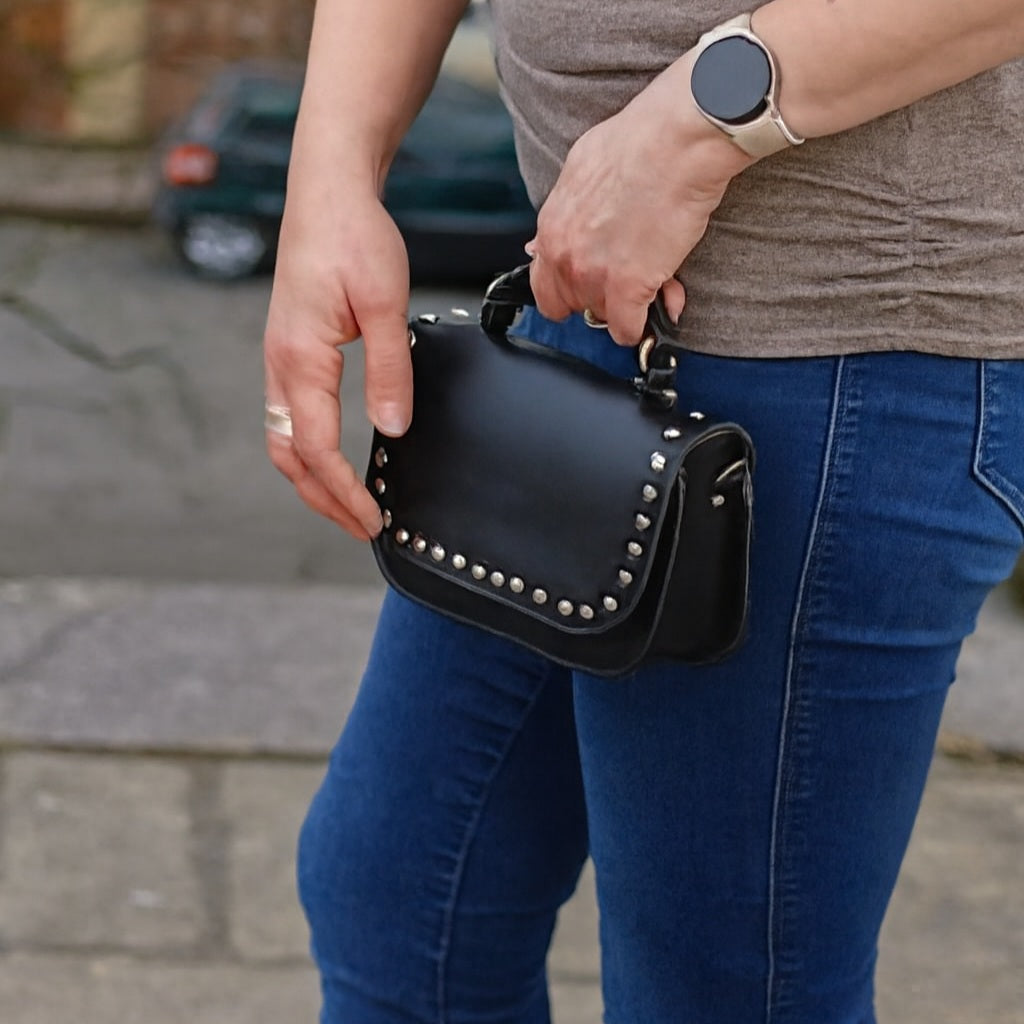 Zatchels Aura black studded clutch bag detail view