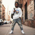Black boy wearing a white autism superpower dino sweatshirt.
