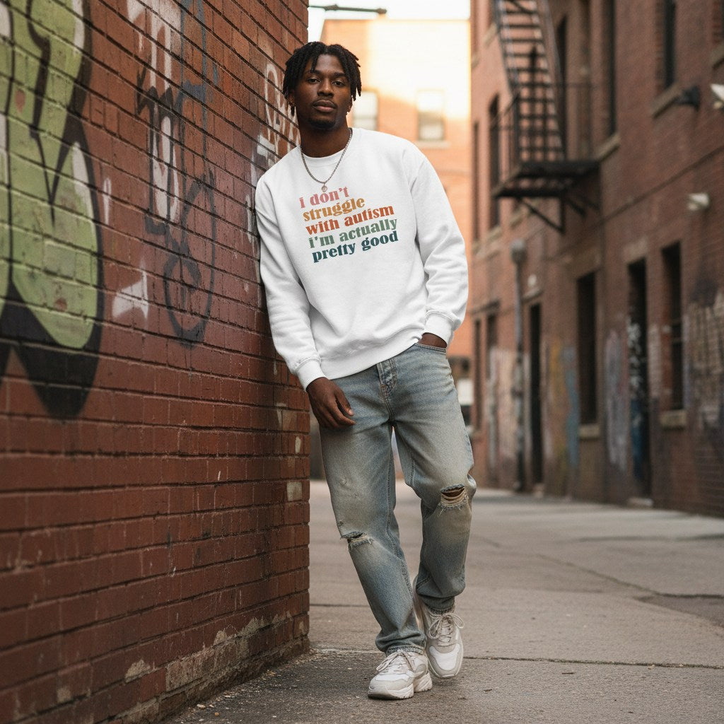 Black man wearing a white autism awareness sweatshirt.