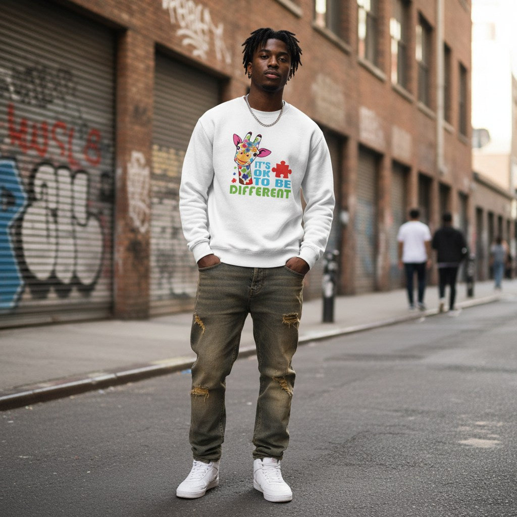 Black man wearing a white It's Ok To Be Different giraffe sweatshirt.