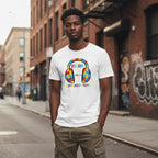 Black man wearing a white autism awareness t-shirt.