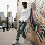Black man wearing a white autism awareness sweatshirt.