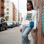 Black woman wearing a white Autism Is My Superpower sweatshirt.