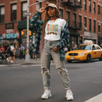 Black woman wearing a white autism awareness T-shirt.