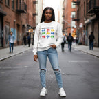 Black woman wearing a white God Says I Am autism awareness sweatshirt.