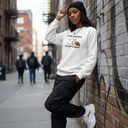 Black woman wearing a white His Fight Is My Fight autism awareness sweatshirt.