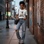 Black woman in streetwear style wearing a white t-shirt outdoors