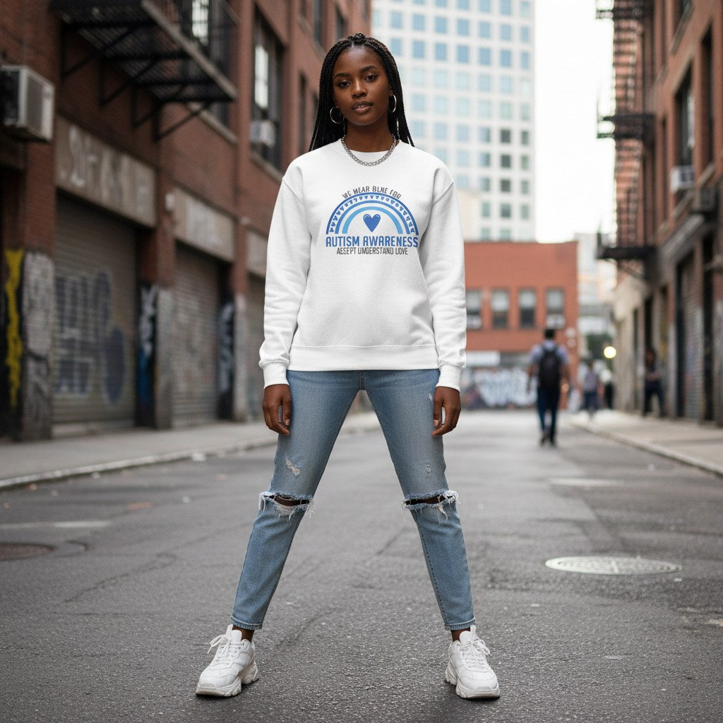 Black woman wearing a white autism awareness sweatshirt.