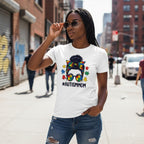 Black woman wearing a white autism mom t-shirt.