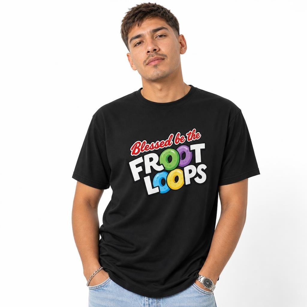 Front view of a model wearing a black T-shirt with “Blessed be the Froot Loops” and colourful cereal rings in the lettering.