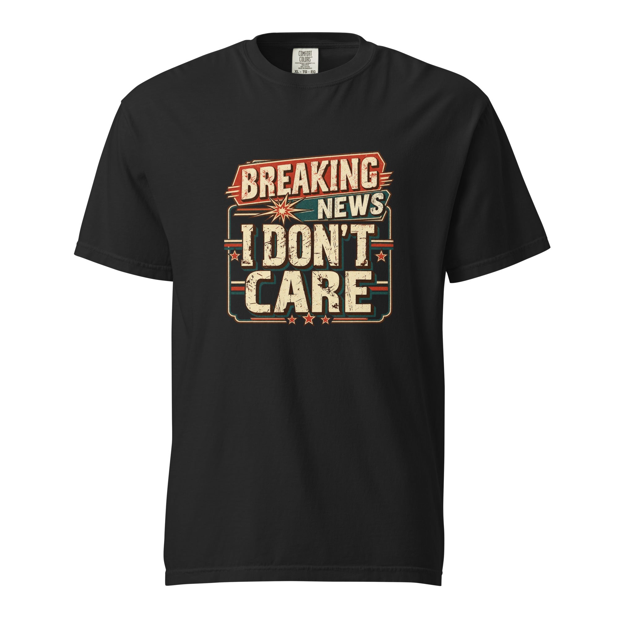Black T-shirt with a distressed retro graphic reading “BREAKING NEWS I DON’T CARE” in bold cream, red, and teal lettering.