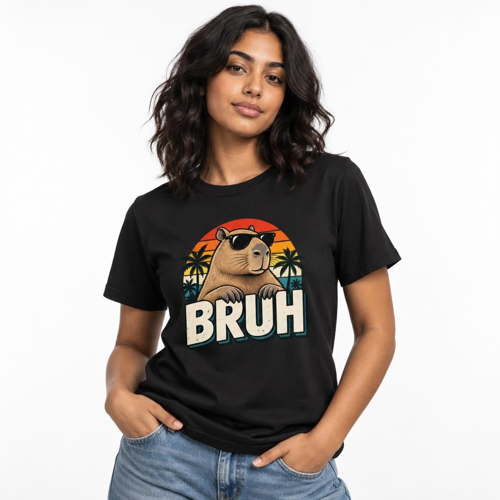 Front view of a person wearing a black T-shirt with a retro capybara in black sunglasses, palm trees, and “BRUH” graphic.