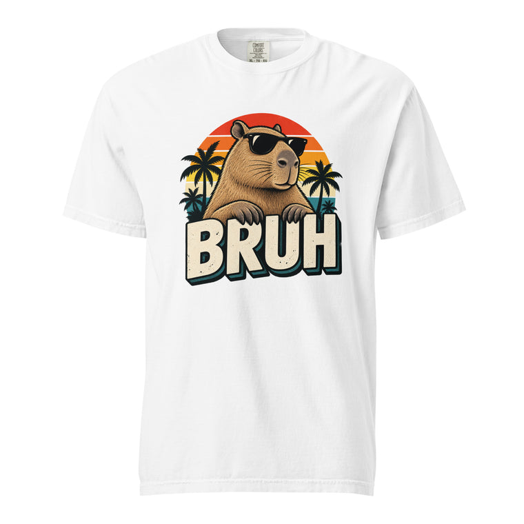 White T-shirt with a retro graphic of a capybara in black sunglasses, palm trees, an orange sunset, and “BRUH” text.