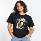 Model wearing a Black T-Shirt with ‘BUTTON MOON’ lettering above a colourful rocket, cartoon astronaut and cratered moon.
