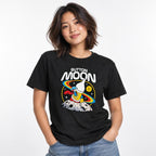 Model wearing a black T-shirt with the text “BUTTON MOON” above a colourful astronaut standing on a cratered moon.