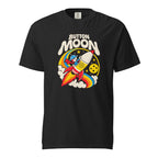 Black T-shirt with cream “BUTTON MOON” lettering above a cartoon astronaut riding a rocket, with a moon, stars and rainbow arcs.