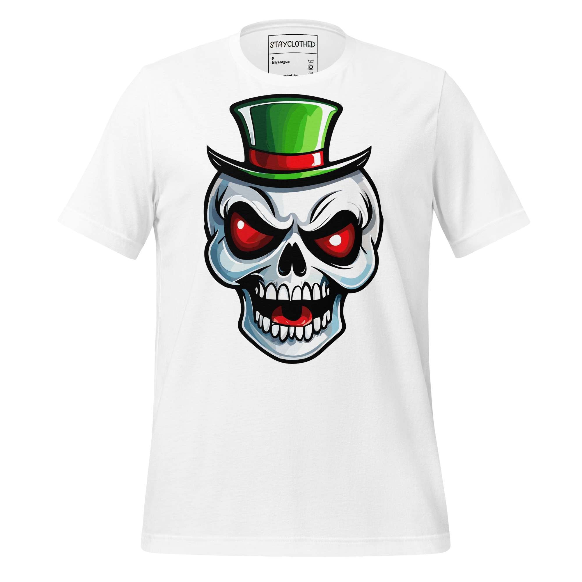 White t-shirt with a St. Patrick's Day skull wearing a green top hat on a wooden surface, featuring the brand 'StayClothed'.