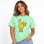 Model wearing an Island Reef T-Shirt featuring a yellow cartoon cat looking backwards, with a raised tail and “Hi” on its rear.
