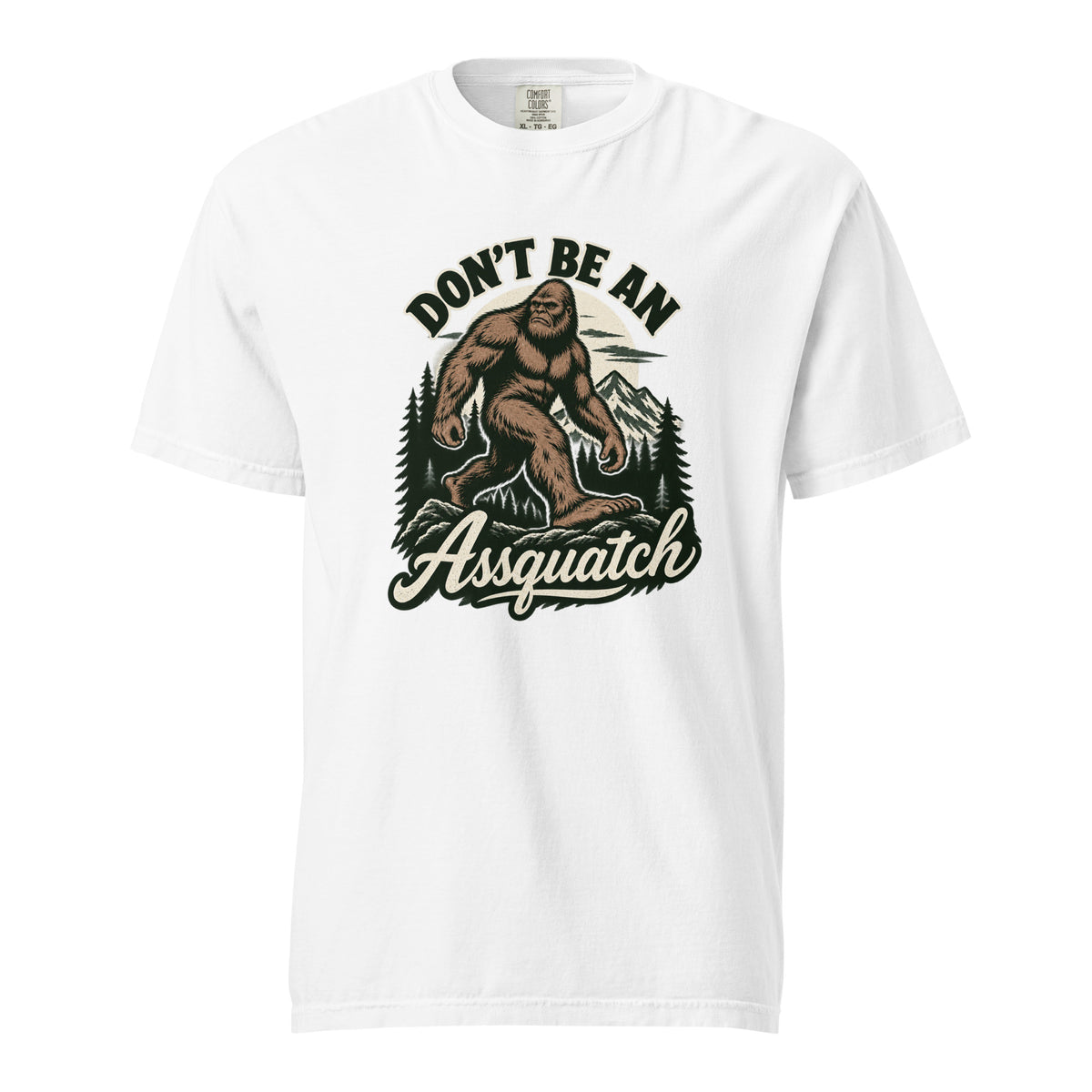 White adult unisex T-shirt with a vintage Sasquatch walking through mountains and pine trees, with "DON’T BE AN Assquatch" text.