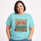 Dont Make Me Slap You With My Flip Flop t shirt in Lagoon Blue worn by a studio model in an upper-body walking pose on a clean white background
