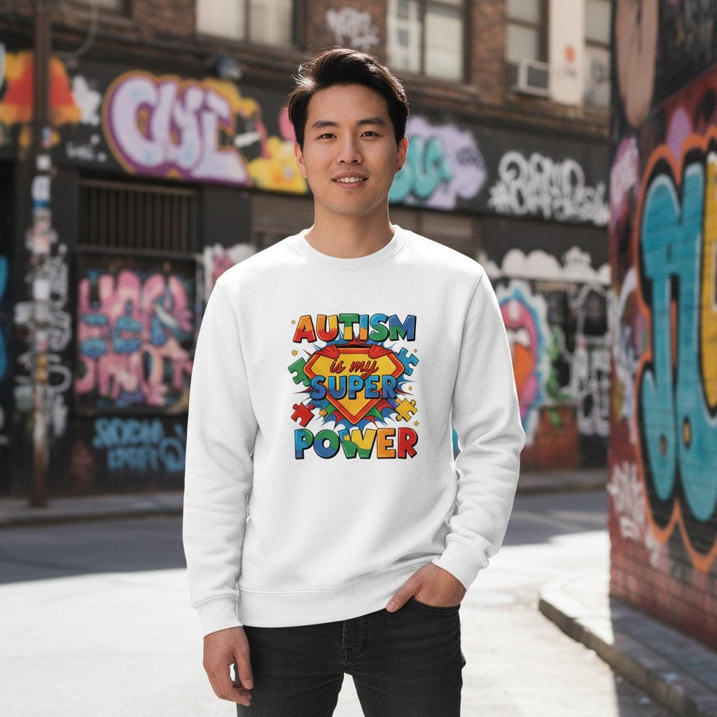 East Asian man wearing a white autism is my superpower sweatshirt.