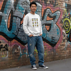 East Asian man wearing a white God Says I Am autism puzzle hearts sweatshirt.