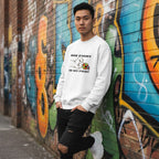 East Asian man wearing a white His Fight Is My Fight autism awareness sweatshirt.