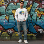 East Asian man wearing a white In April We Wear Blue autism sunflower sweatshirt.