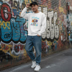 East Asian man wearing a white It's Okay To Be Different autism awareness elephant sweatshirt.