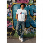 East Asian man wearing a white Love Needs No Words autism awareness t-shirt.