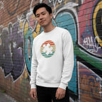 East Asian man wearing a white retro sunset puzzle piece autism awareness sweatshirt.