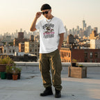 East Asian man wearing a white unisex basic softstyle t-shirt in an urban streetwear setting