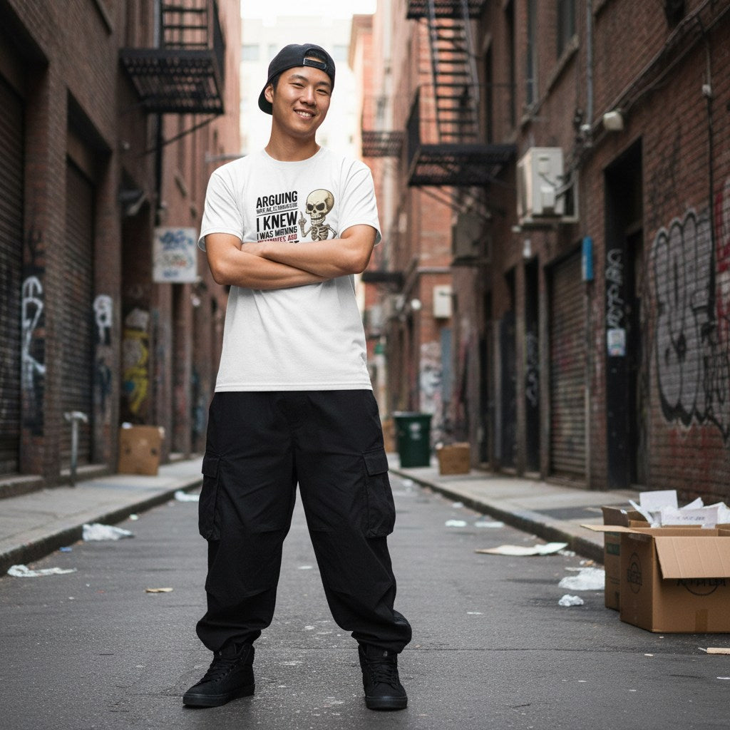 East Asian man wearing a white streetwear t-shirt in an urban setting