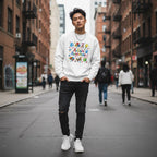 East Asian man wearing a white autism awareness sweatshirt.