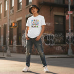 East Asian non-binary person wearing a white autism awareness t-shirt.