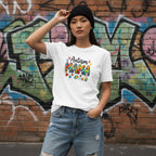 East Asian woman wearing a white autism mama t-shirt.