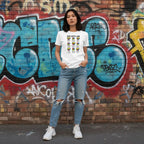 East Asian woman wearing a white God Says I Am puzzle hearts t-shirt.