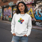 East Asian woman wearing a white puzzle heart logo autism awareness sweatshirt.