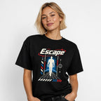 Escape Graphic Unisex Cotton t shirt in Black worn by a studio model in an upper-body walking pose on a clean white background