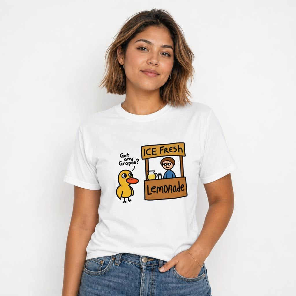 Model wearing a white T-shirt featuring a cartoon duck beside a lemonade stand labeled “ICE Fresh” and “Lemonade.”