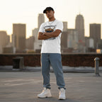Hispanic man in streetwear style photo wearing a white t-shirt featuring a funny highland cow design.